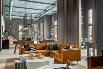 Gaming lounge with billiards, foosball, shuffleboard, and vintage arcade games